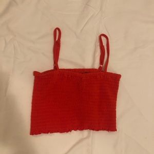 Orange cropped summer shirt.